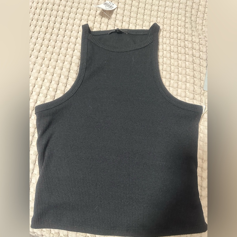Stylish black tank top by Iris in size Small